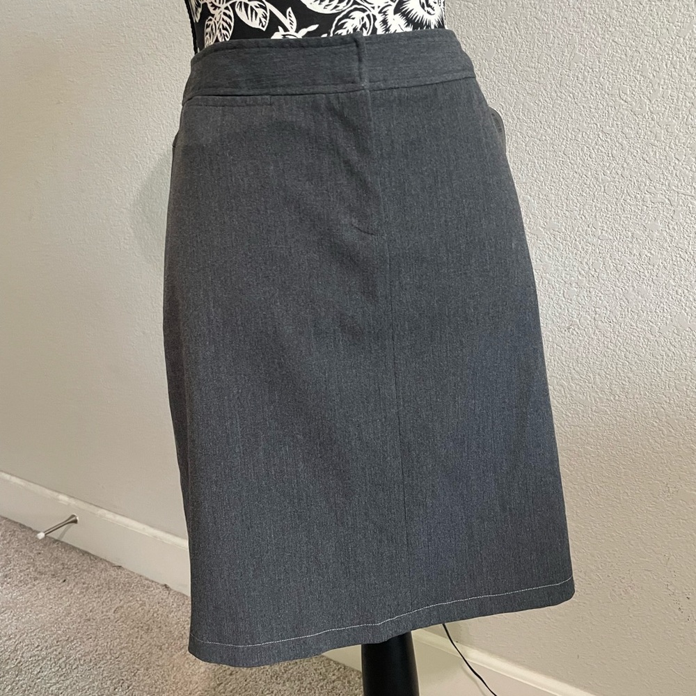 Gray skirt with front zipper. Size 8